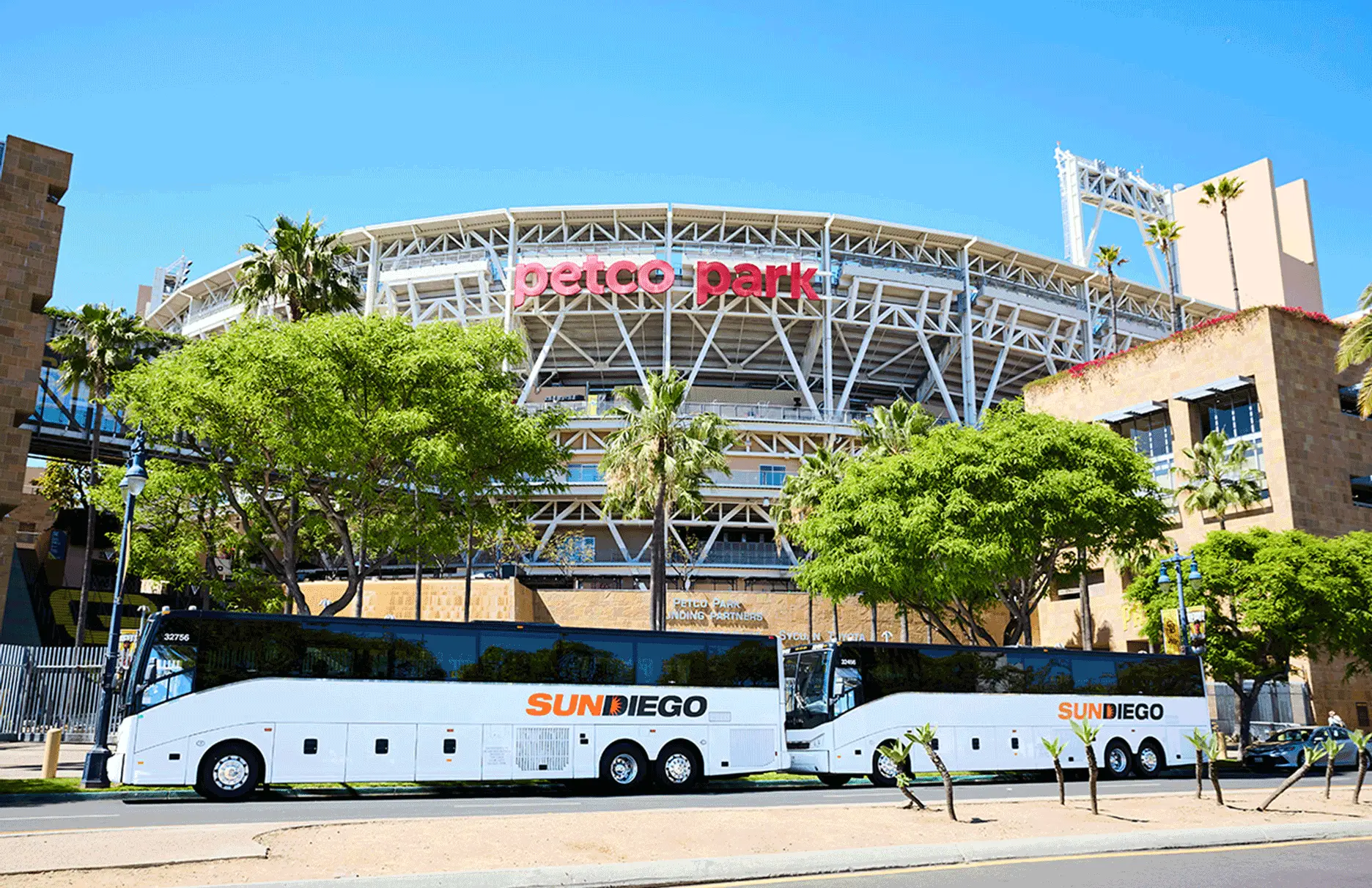 Sun Diego Charter motorcoaches parked outside Petco Park