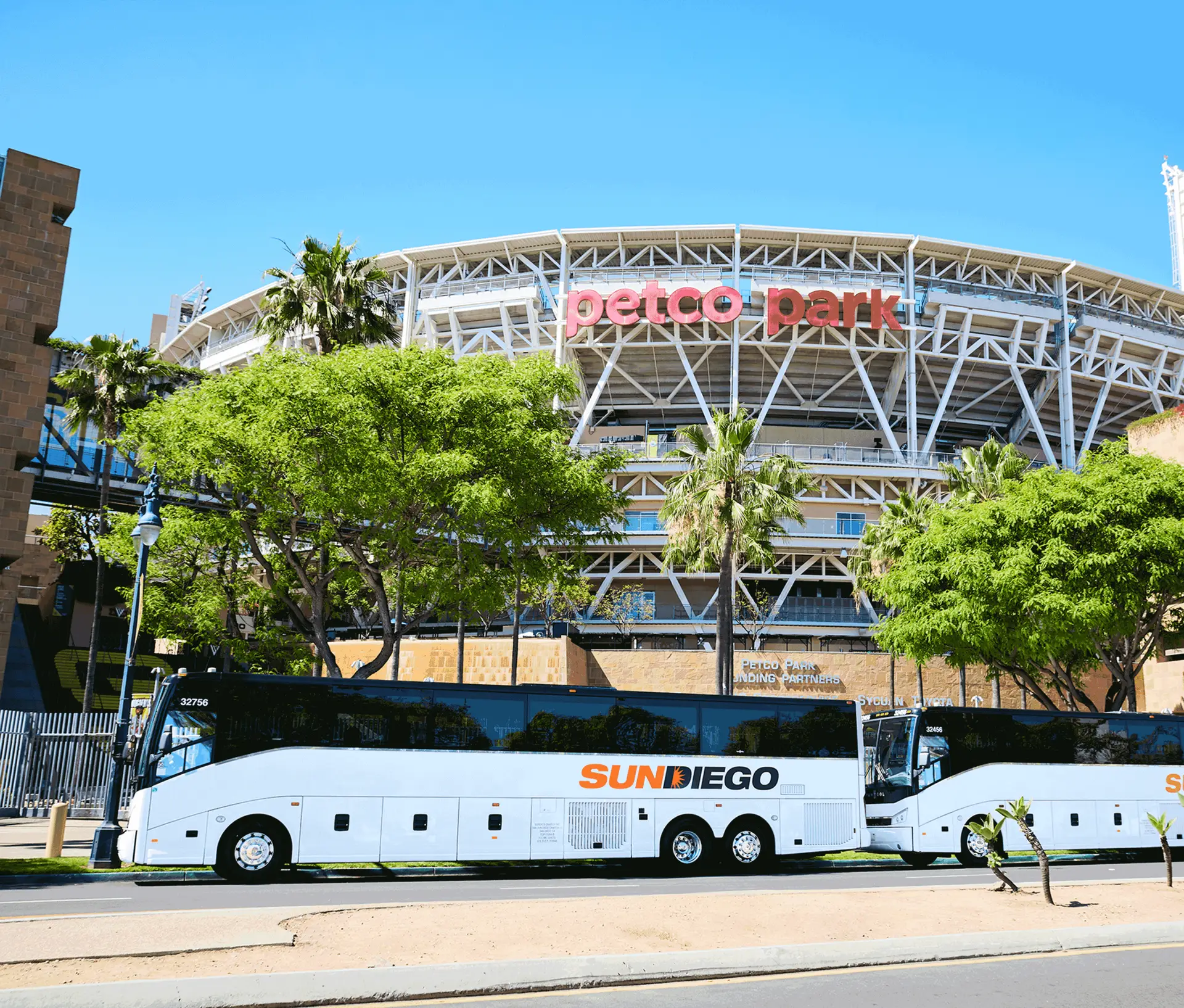 Sun Diego Charter motorcoaches parked outside Petco Park