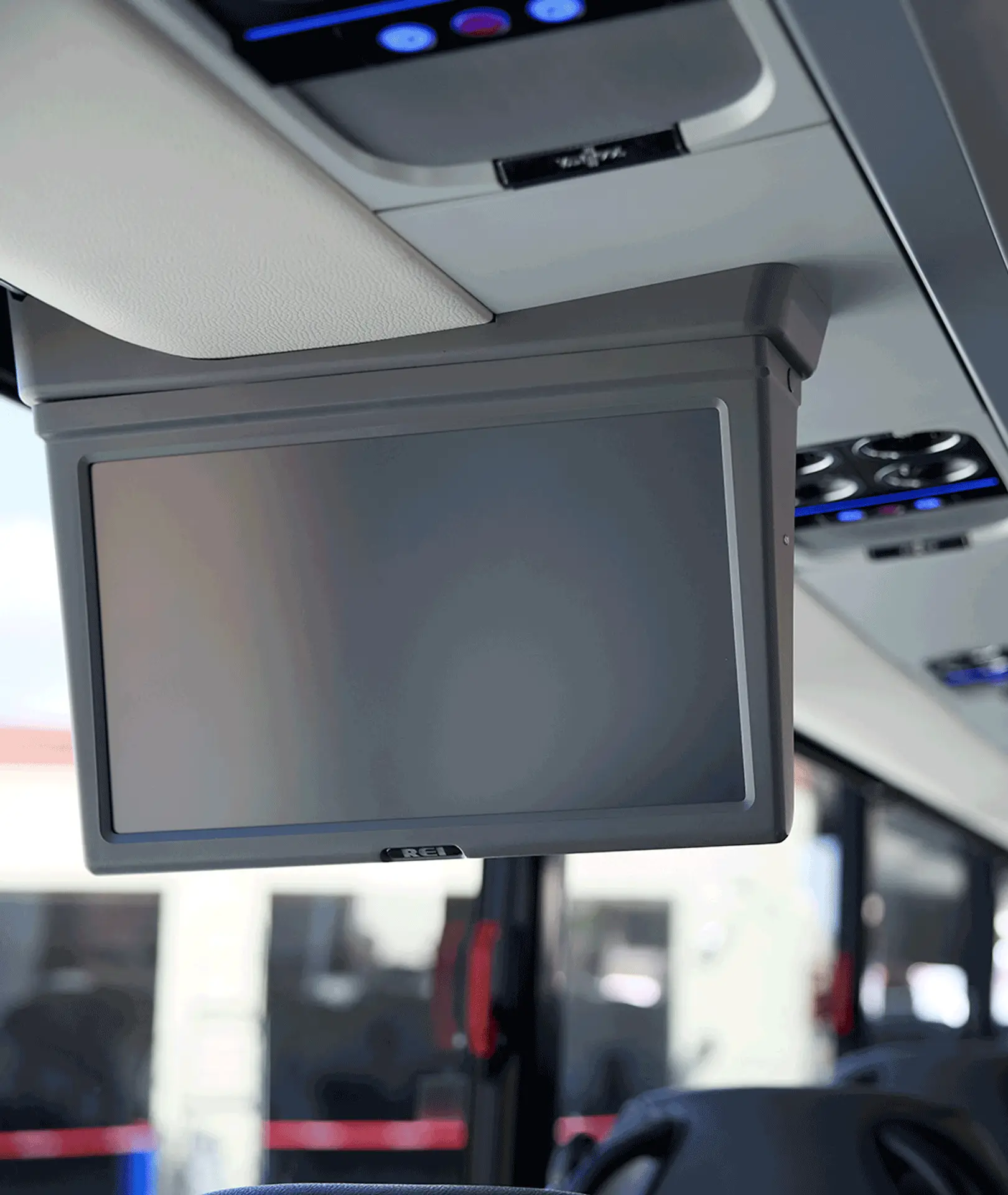 Overhead monitor and passenger air vents inside a motorcoach