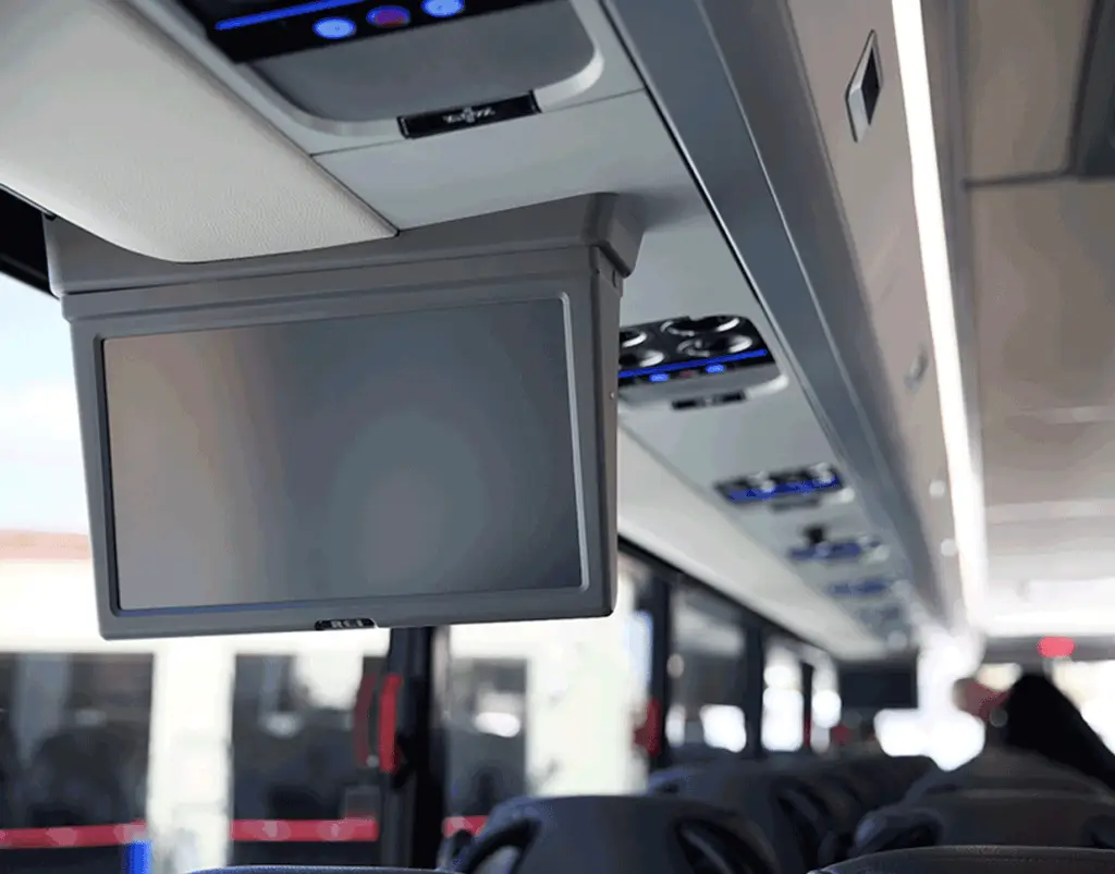 Overhead monitor and passenger air vents inside a motorcoach