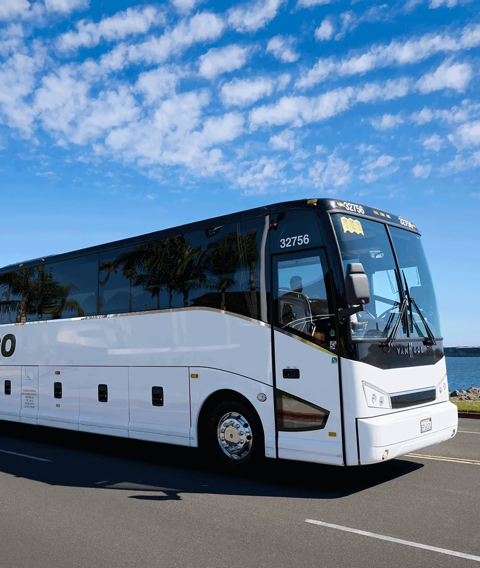 Sun Diego Charter motorcoach parked under a blue sky