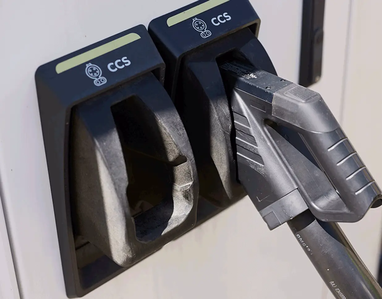Electric vehicle charging connectors at a charging station