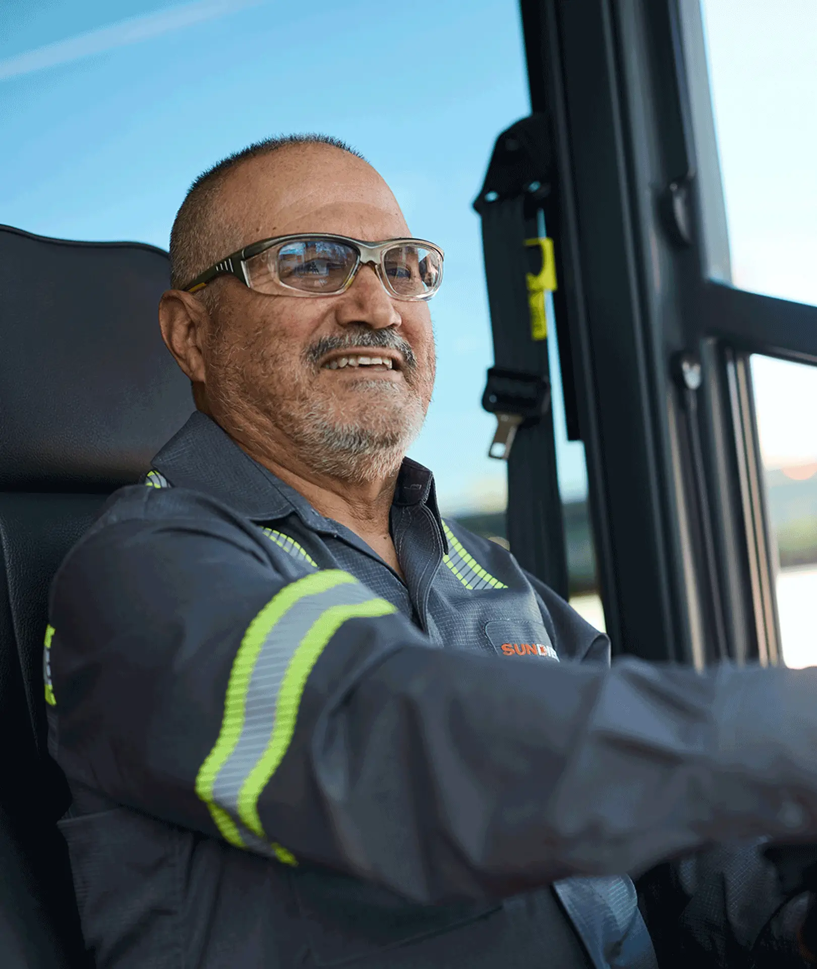Sun Diego Charter team member seated at the wheel