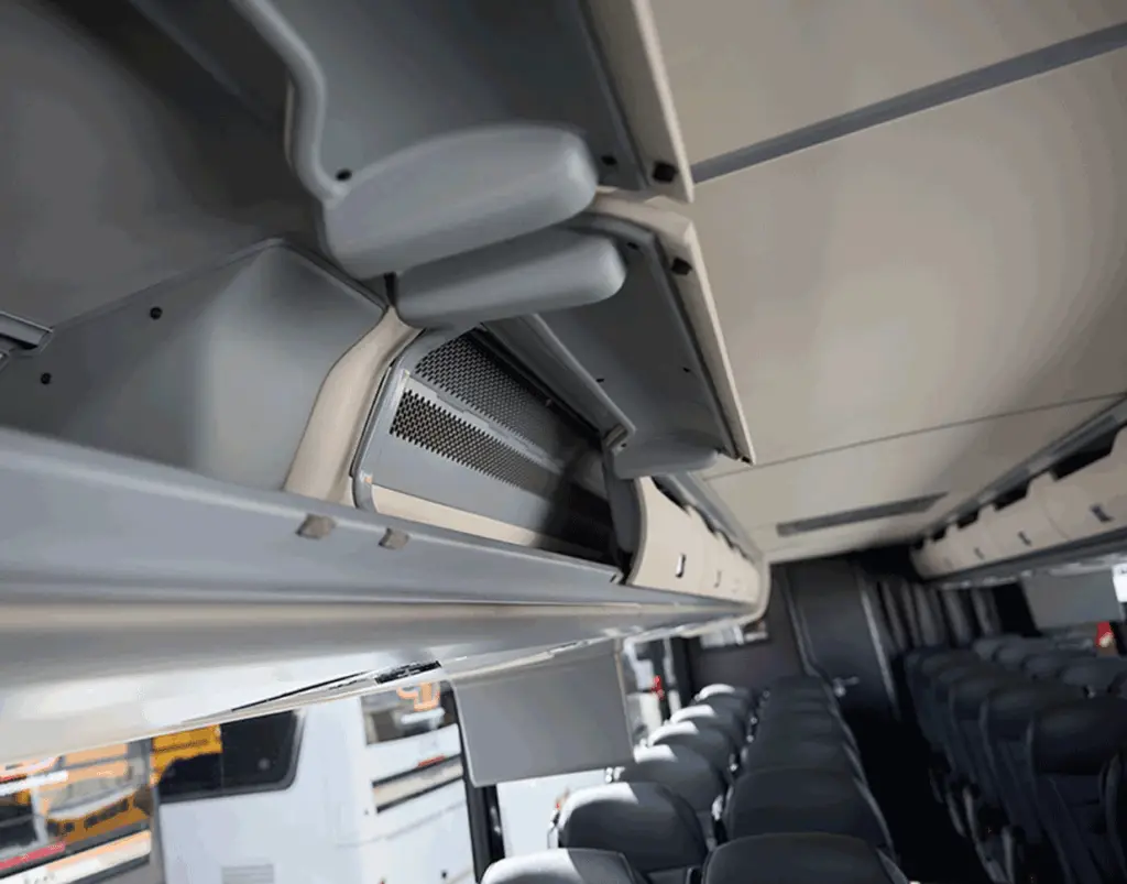 Overhead luggage compartments above motorcoach passenger seats