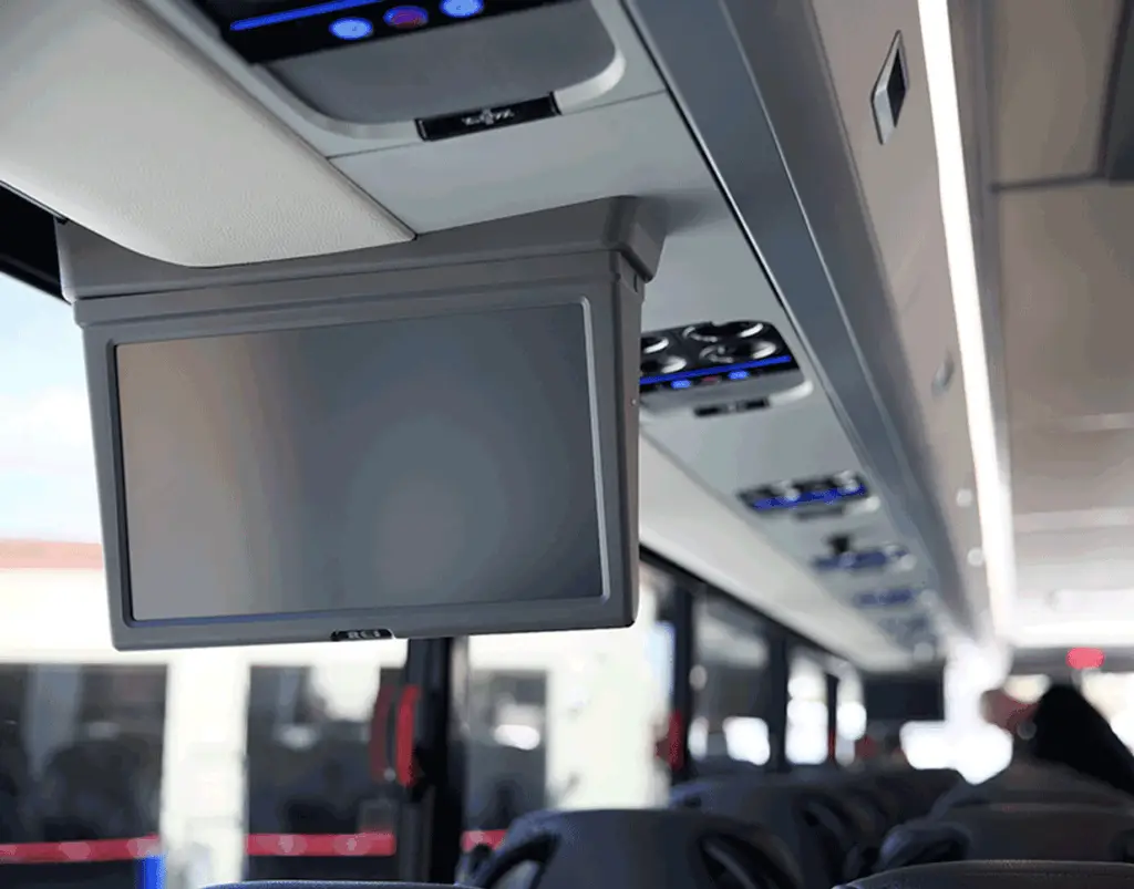 Overhead monitor and passenger air vents inside a motorcoach