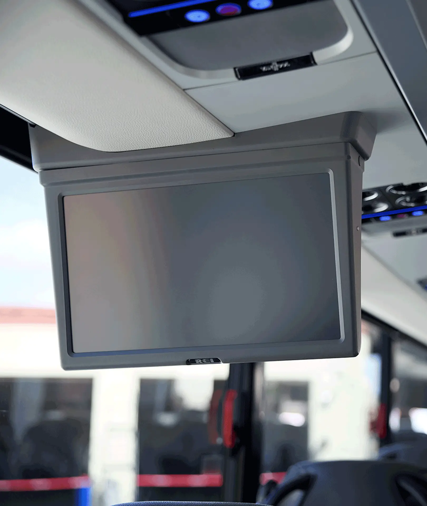 Overhead monitor and passenger air vents inside a motorcoach