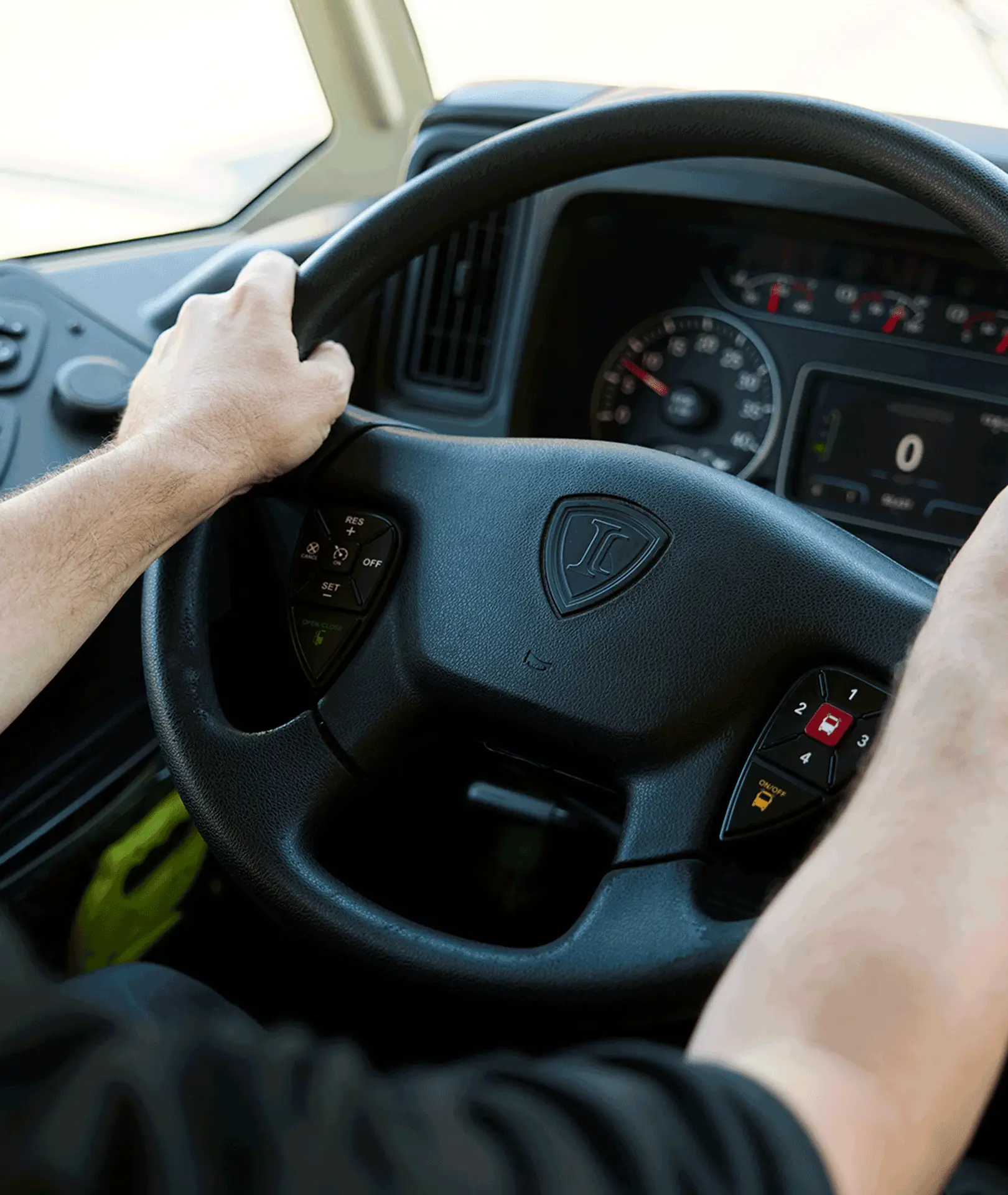 Driver holding a motorcoach steering wheel