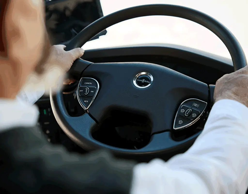 Sun Diego Charter driver holding a motorcoach steering wheel