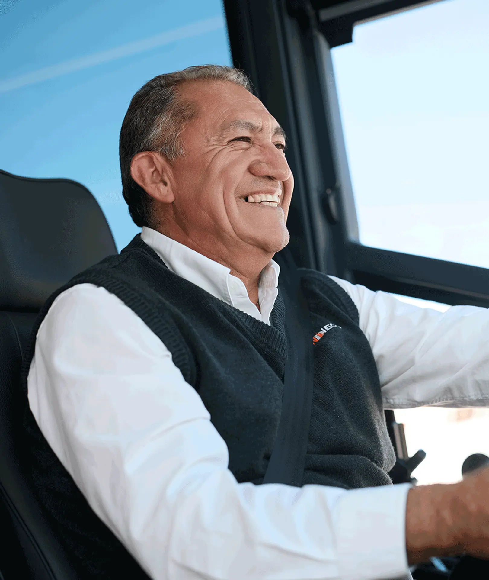 Smiling Sun Diego Charter driver seated at the wheel