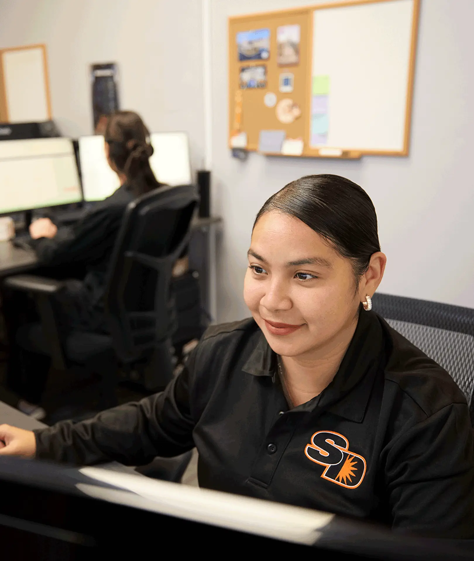 Sun Diego Charter team member working at a computer