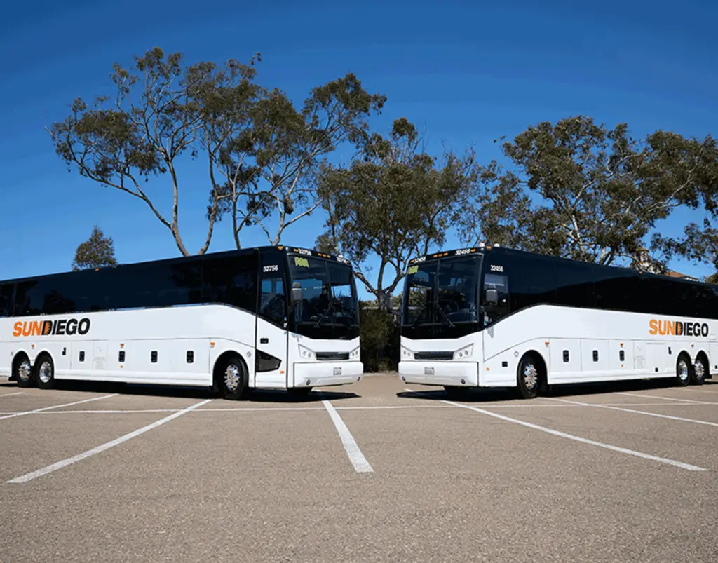 Two Sun Diego Charter motorcoaches parked side by side