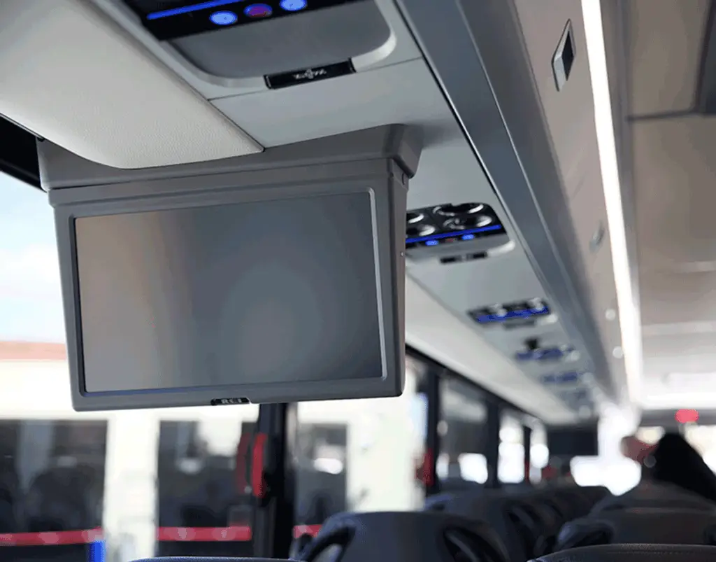 Overhead monitor and passenger air vents inside a motorcoach
